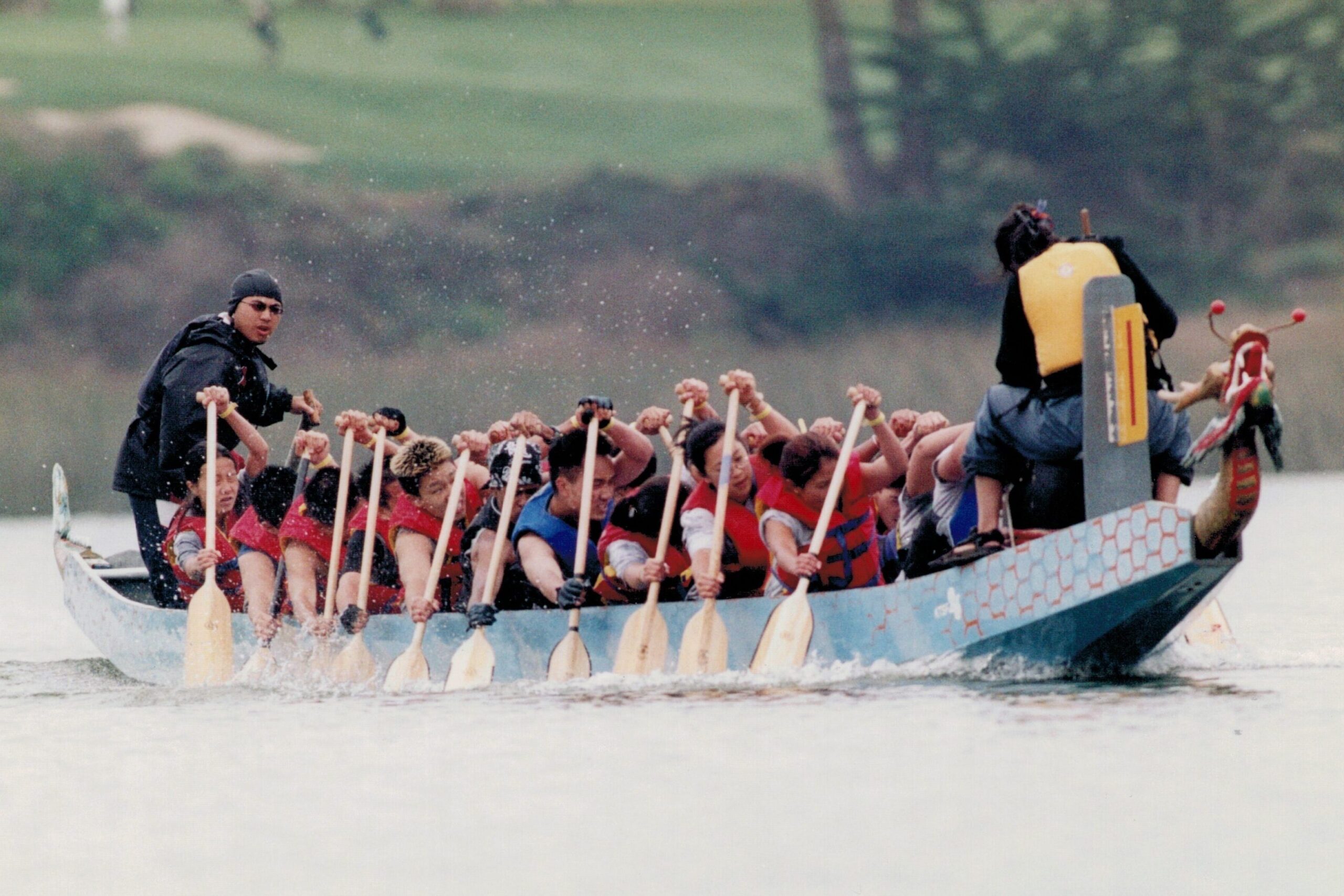 Kara leading students on a Dragon Boat.